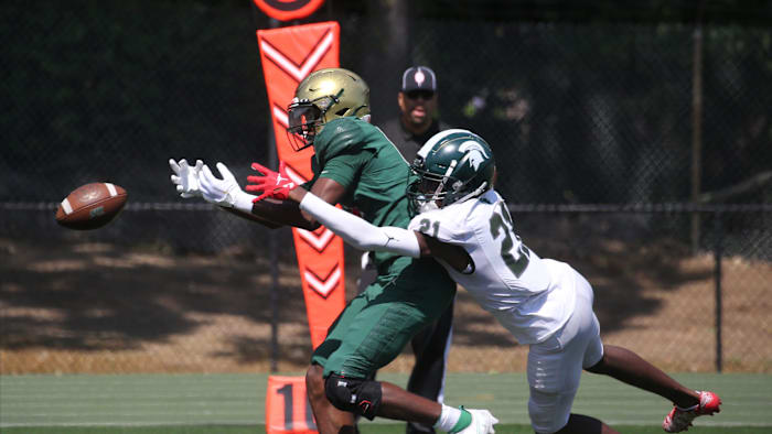 Donovan Mckoy of St. Joseph's has the ball knocked away by Deshawn Stewart of DePaul as DePaul lost