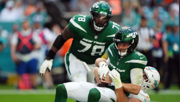 Dec 17, 2023; Miami Gardens, Florida, USA; Miami Dolphins defensive tackle Zach Sieler (92) sacks New York Jets quarterback Zach Wilson (2) during the first half at Hard Rock Stadium.