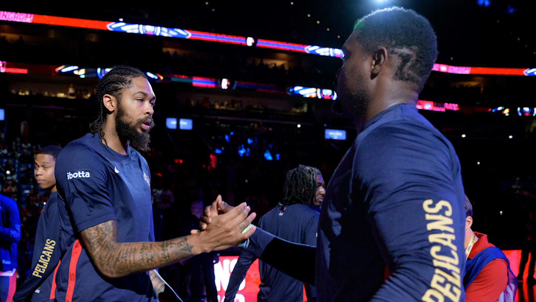 Oct 10, 2023; New Orleans, Louisiana, USA; New Orleans Pelicans forward Brandon Ingram, left, greets New Orleans Pelicans forward Zion Williamson during introductions before a game against the Orlando Magic at the Smoothie King Center.