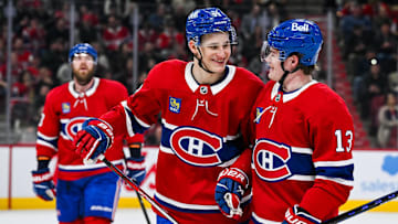 Apr 14, 2025; Montreal, Quebec, CAN; Montreal Canadiens right wing Ivan Demidov (93) celebrates with right wing Cole Caufield (13) after his first career goal against the Chicago Blackhawks in the first period at Bell Centre. Mandatory Credit: David Kirouac-Imagn Images