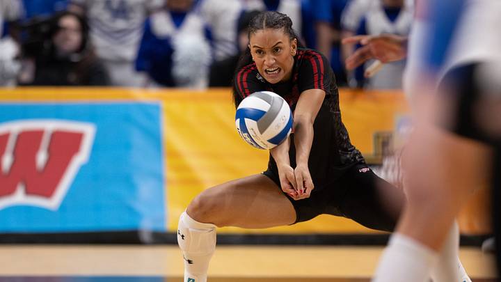Dec 18, 2025; Kansas City, MO, USA;  Wisconsin Badgers outside hitter Grace Egan (32) hits the ball in a 2025 NCAA Women’s Volleyball Championship semifinal match at T-Mobile Center. Mandatory Credit: Kylie Graham-Imagn Images