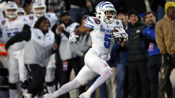 Dec 29, 2023; Memphis, TN, USA; Memphis Tigers running back Sutton Smith (5) runs the ball during the second half  against the Iowa State Cyclones at Simmons Bank Liberty Stadium. Mandatory Credit: Petre Thomas-USA TODAY Sports