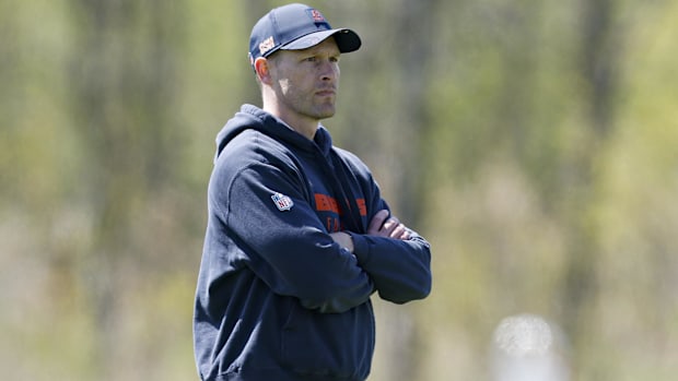  Chicago Bears head coach Ben Johnson (R) looks on during the Rookie Minicamp 