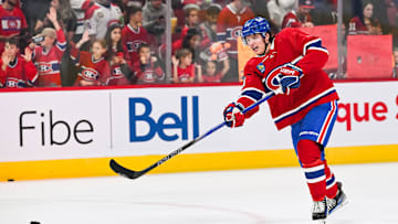 Sep 30, 2023; Montreal, Quebec, CAN; Montreal Canadiens defenseman David Reinbacher (64) shoots a puck during warm-up before the game against the Toronto Maple Leafs at Bell Centre. Mandatory Credit: David Kirouac-Imagn Images
