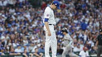 Jul 20, 2024; Chicago, Illinois, USA; Chicago Cubs starting pitcher Kyle Hendricks (28) reacts after giving up a two-run home run to Arizona Diamondbacks outfielder Corbin Carroll during the fifth inning at Wrigley Field. Mandatory Credit: Kamil Krzaczynski-Imagn Images