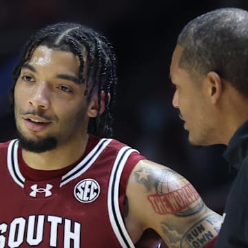 Mar 8, 2025; Knoxville, Tennessee, USA; South Carolina Gamecocks guard Jacobi Wright (1) speaks with head coach Lamont Paris during the first half against the Tennessee Volunteers at Thompson-Boling Arena at Food City Center. Mandatory Credit: Randy Sartin-Imagn Images