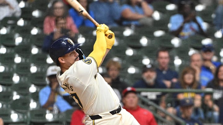 Sep 3, 2024; Milwaukee, Wisconsin, USA; Milwaukee Brewers shortstop Willy Adames (27) hits a double against the St. Louis Cardinals in the eleventh inning at American Family Field. Mandatory Credit: Michael McLoone-Imagn Images