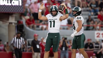 Oct 4, 2025; Lincoln, Nebraska, USA; Michigan State Spartans quarterback Alessio Milivojevic (11) celebrates after a touchdown during the fourth quarter of the game against Nebraska at Memorial Stadium. Mandatory Credit: Kylie Graham-Imagn Images