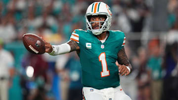 Sep 12, 2024; Miami Gardens, Florida, USA; Miami Dolphins quarterback Tua Tagovailoa (1) tosses the ball during the first half against the Buffalo Bills at Hard Rock Stadium. Mandatory Credit: Jasen Vinlove-Imagn Images