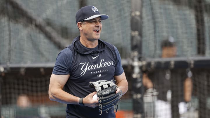 Aug 12, 2024; Chicago, Illinois, USA; New York Yankees manager Aaron Boone (17) warms up during batting practice before a game against the Chicago White Sox at Guaranteed Rate Field. Mandatory Credit: Kamil Krzaczynski-USA TODAY Sports