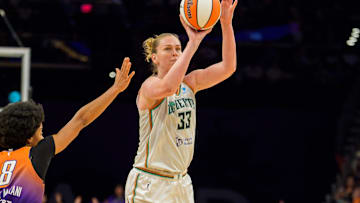 Aug 30, 2025; Phoenix, Arizona, USA; New York Liberty forward Emma Meesseman (33) pulls up from just outside the three point line in the second half to shoot as Phoenix Mercury guard Monique Akoa Makani (8) reacts too late to stop the shot during a game at Footprint Center. Mandatory Credit: Allan Henry-Imagn Images