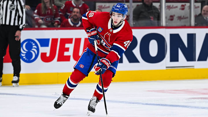 Apr 14, 2025; Montreal, Quebec, CAN; Montreal Canadiens defenseman Lane Hutson (48) plays the puck against the Chicago Blackhawks in the second period at Bell Centre. Mandatory Credit: David Kirouac-Imagn Images