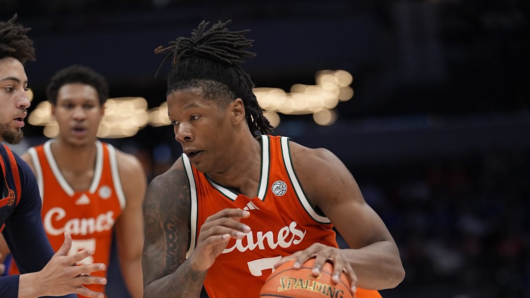 Mar 13, 2026; Charlotte, NC, USA; Miami Hurricanes forward Shelton Henderson (7) goes to the basket against the Virginia Cavaliers during the second half at Spectrum Center. Mandatory Credit: Jim Dedmon-Imagn Images