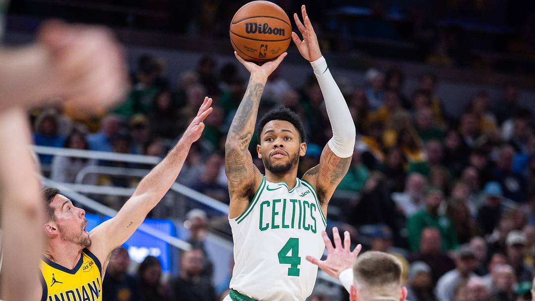 Dec 26, 2025; Indianapolis, Indiana, USA; Boston Celtics guard Anfernee Simons (4) shoots the ball while Indiana Pacers guard T.J. McConnell (9) defends in the second half at Gainbridge Fieldhouse. Mandatory Credit: Trevor Ruszkowski-Imagn Images