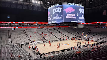 The Arkansas Razorbacks take in the final moments of their warm-up at Dickies Arena 45 minutes before an exhibition game against the TCU Horned Frogs in Fort Worth.