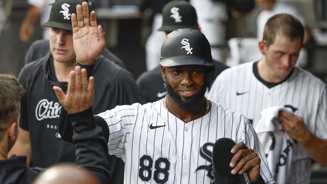 Jun 25, 2024; Chicago, Illinois, USA; Chicago White Sox outfielder Luis Robert Jr. (88) celebrates with teammates after scoring against the Los Angeles Dodgers during the first inning at Guaranteed Rate Field.
