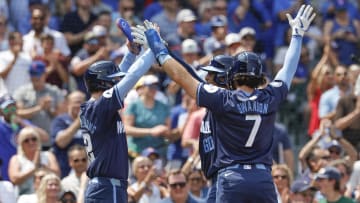 Aug 2, 2024; Chicago, Illinois, USA; Chicago Cubs catcher Christian Bethancourt (60) celebrates with shortstop Dansby Swanson (7) and outfielder Pete Crow-Armstrong (52) after hitting a three run home run against the St. Louis Cardinals during the second inning at Wrigley Field.