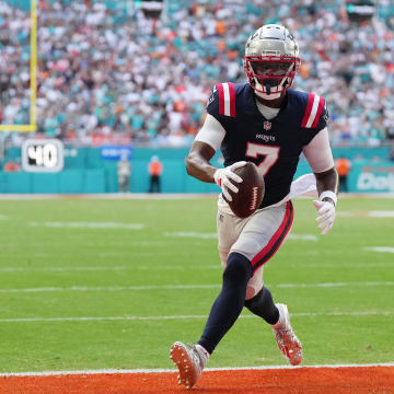 Oct 29, 2023; Miami Gardens, Florida, USA; New England Patriots wide receiver JuJu Smith-Schuster (7) runs in for a touchdown against the Miami Dolphins during the second half at Hard Rock Stadium. Mandatory Credit: Jasen Vinlove-USA TODAY Sports