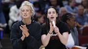 Jun 7, 2025; Chicago, Illinois, USA; Injured Indiana Fever guard Sophie Cunningham (8) and guard Caitlin Clark (22) react from the bench during the first half of a WNBA game against the Chicago Sky at United Center. Mandatory Credit: Kamil Krzaczynski-Imagn Images