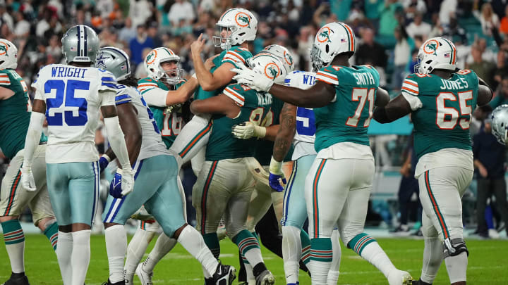 Miami Dolphins kicker Jason Sanders (7) celebrates with teammates after kicking the game winning field goal against the Dallas Cowboys at Hard Rock Stadium.