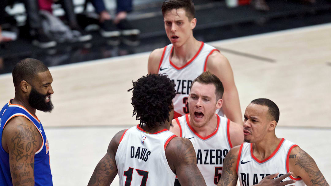 Mar 6, 2018; Portland, OR, USA; Portland Trail Blazers guard Shabazz Napier (6), guard Pat Connaughton (5), and center Zach Collins (33) react after forward Ed Davis (17) blocked the shot of New York Knicks center Kyle O'Quinn (9) during the second quarter at the Moda Center. Mandatory Credit: Craig Mitchelldyer-Imagn Images