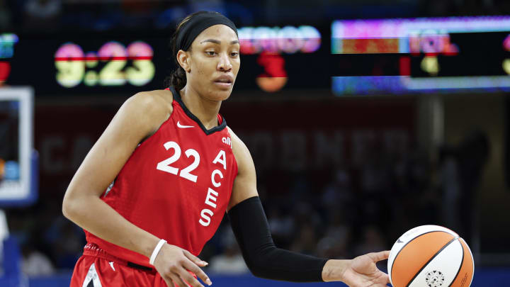 Aug 25, 2024; Chicago, Illinois, USA; Las Vegas Aces center A'ja Wilson (22) passes the ball against the Chicago Sky during the second half at Wintrust Arena. Mandatory Credit: Kamil Krzaczynski-USA TODAY Sports