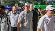 Nov 22, 2025; Orlando, Florida, USA; UCF Knights head coach Scott Frost walks into the venue before the game against the Oklahoma State Cowboys at Acrisure Bounce House. Mandatory Credit: Mike Watters-Imagn Images
