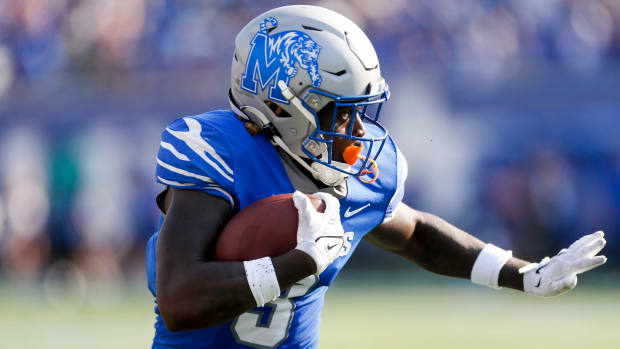 Memphis Tigers wide receiver Roc Taylor scores a touchdown during a college football game.