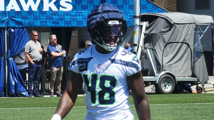 Seahawks linebacker Tyrice Knight walks back to the huddle after a drill during the team's mandatory minicamp at the VMAC.