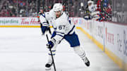 Jan 18, 2025; Montreal, Quebec, CAN; Toronto Maple Leafs left wing Max Pacioretty (67) plays the puck against the Montreal Canadiens during the first period at Bell Centre. Mandatory Credit: David Kirouac-Imagn Images