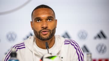 Bayer Leverkusen defender Jonathan Tah coy on future amidst interest from Bayern Munich.