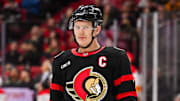 Nov 25, 2024; Ottawa, Ontario, CAN; Ottawa Senators left wing Brady Tkachuk (7) looks on against the Calgary Flames during the third period at Canadian Tire Centre. Mandatory Credit: David Kirouac-Imagn Images
