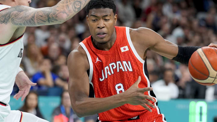 Jul 27, 2024; Villeneuve-d'Ascq, France; Japan small forward Rui Hachimura (8) looks to move past Germany power forward Daniel Theis (10) during the Paris 2024 Olympic Summer Games at Stade Pierre-Mauroy. Mandatory Credit: John David Mercer-USA TODAY Sports