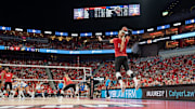 Louisville's Anna DeBeer (14) served the ball in the fourth set as the No. 3 Louisville Cardinals women's volleyball team faced off against the No. 1 Pitt Panthers on Wednesday, Nov. 27, 2024.
