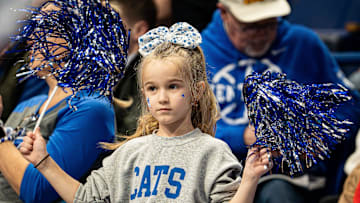 A little Kentucky fan waved her pom-poms as the Wildcats faced off against the Brown Bears at Rupp Arena on New Year's Eve, Tuesday, Dec. 31, 2024.