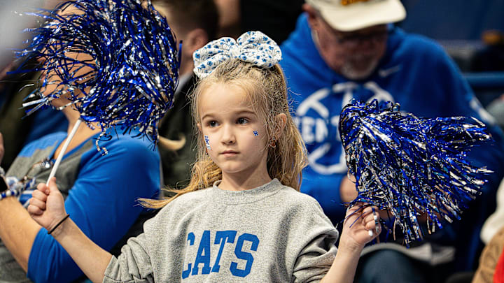 A little Kentucky fan waved her pom-poms as the Wildcats faced off against the Brown Bears at Rupp Arena on New Year's Eve, Tuesday, Dec. 31, 2024.