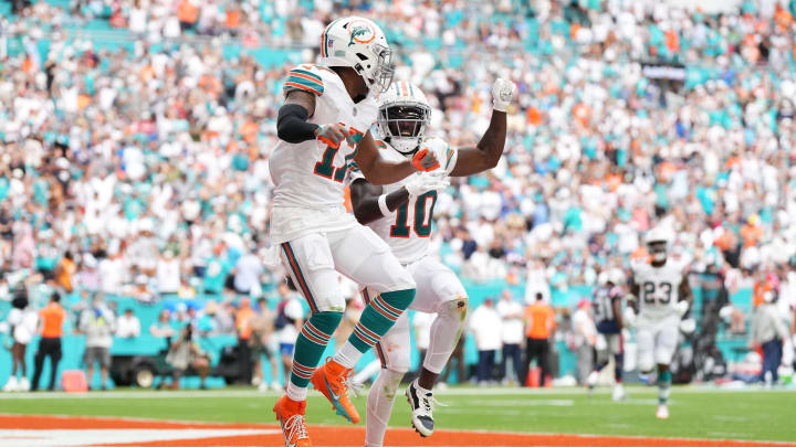 Miami Dolphins wide receiver Jaylen Waddle (17) celebrates his touchdown against the New England Patriots with wide receiver Tyreek Hill (10) during the second half at Hard Rock Stadium last season.