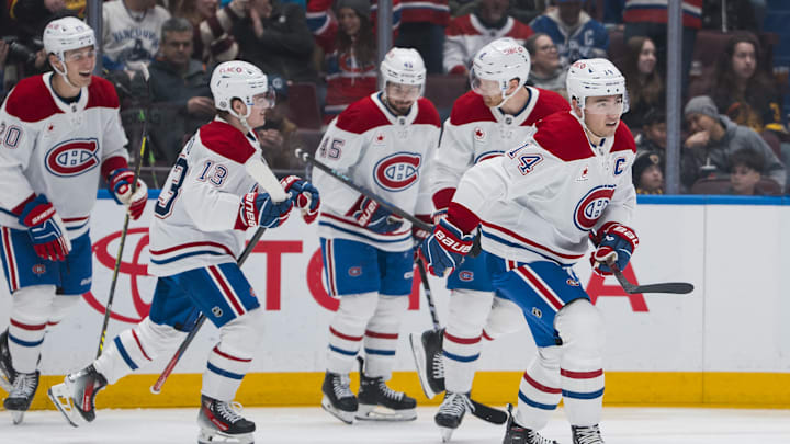 Mar 11, 2025; Vancouver, British Columbia, CAN; Montreal Canadiens forward Nick Suzuki (14) celebrates his goal against the Vancouver Canucks in the first period at Rogers Arena. Mandatory Credit: Bob Frid-Imagn Images
