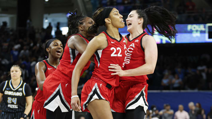 Las Vegas Aces center A'ja Wilson (22) celebrates with teammates after scoring game winning basket against the Chicago Sky.