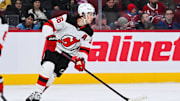 Feb 8, 2025; Montreal, Quebec, CAN; New Jersey Devils center Jack Hughes (86) plays the puck against the Montreal Canadiens during the second period at Bell Centre. Mandatory Credit: David Kirouac-Imagn Images