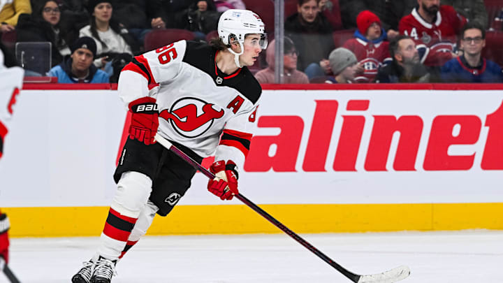 Feb 8, 2025; Montreal, Quebec, CAN; New Jersey Devils center Jack Hughes (86) plays the puck against the Montreal Canadiens during the second period at Bell Centre. Mandatory Credit: David Kirouac-Imagn Images