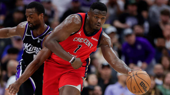 Apr 2, 2024; Sacramento, California, USA; New Orleans Pelicans forward Zion Williamson (1) dribbles the ball past Sacramento Kings forward Harrison Barnes (40) during the third quarter at Golden 1 Center.