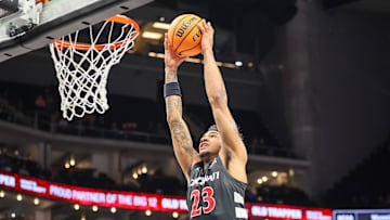 Mar 12, 2025; Kansas City, MO, USA; Cincinnati Bearcats forward Dillon Mitchell (23) dunks during the second half against the Iowa State Cyclones at T-Mobile Center. Mandatory Credit: William Purnell-Imagn Images
