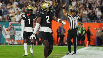 Dec 22, 2023; Tampa, FL, USA; UCF Knights wide receiver Kobe Hudson (2) celebrates his touchdown against the Georgia Tech Yellow Jackets during the first half of the Gasparilla Bowl at Raymond James Stadium. Mandatory Credit: Jasen Vinlove-USA TODAY Sports