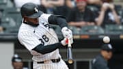 Chicago White Sox center fielder Luis Robert Jr. (88) hits a three-run double against the Milwaukee Brewers at Rate Field. 