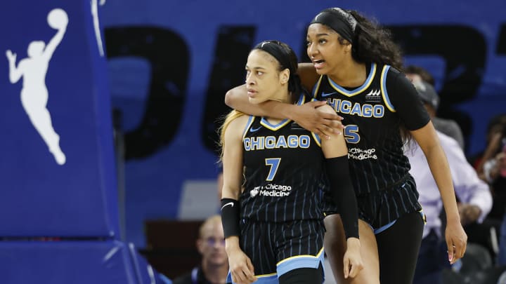 Aug 25, 2024; Chicago, Illinois, USA; Chicago Sky guard Chennedy Carter (7) reacts next to forward Angel Reese (5) after scoring against the Las Vegas Aces during the second half at Wintrust Arena. Mandatory Credit: Kamil Krzaczynski-USA TODAY Sports