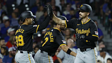 Sep 2, 2024; Chicago, Illinois, USA; Pittsburgh Pirates outfielder Bryan Reynolds (10) celebrates with teammates after hitting a three-run home run against the Chicago Cubs during the eight inning at Wrigley Field. Mandatory Credit: Kamil Krzaczynski-Imagn Images