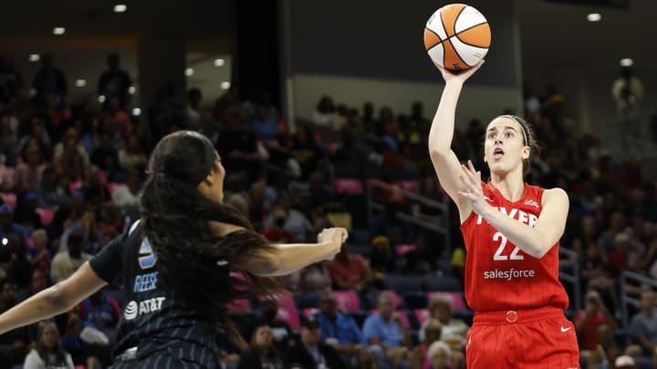 Aug 30, 2024; Chicago, Illinois, USA; Indiana Fever guard Caitlin Clark (22) shoots against Chicago Sky forward Angel Reese (5) during the first half at Wintrust Arena. Mandatory Credit: Kamil Krzaczynski-USA TODAY Sports