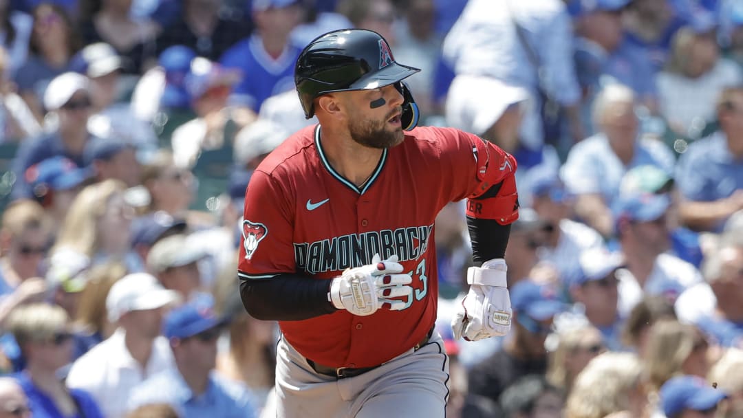 Jul 19, 2024; Chicago, Illinois, USA; Arizona Diamondbacks first baseman Christian Walker (53) watches his two-run single against the Chicago Cubs during the third inning at Wrigley Field. Mandatory Credit: Kamil Krzaczynski-USA TODAY Sports