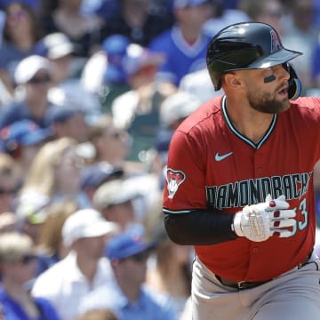 Jul 19, 2024; Chicago, Illinois, USA; Arizona Diamondbacks first baseman Christian Walker (53) watches his two-run single against the Chicago Cubs during the third inning at Wrigley Field. Mandatory Credit: Kamil Krzaczynski-USA TODAY Sports